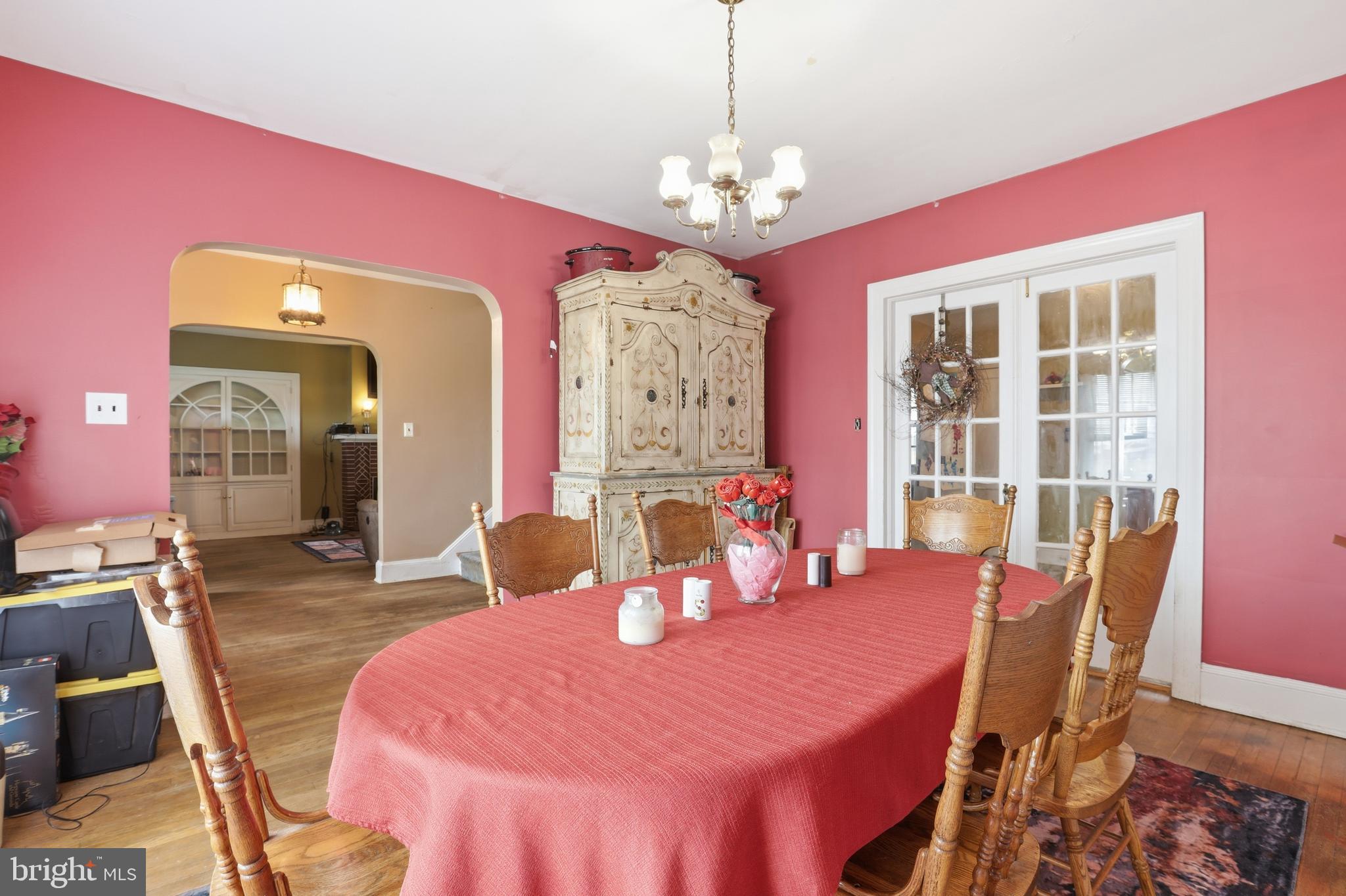 32076 Gordy Road Laurel, DE 19956 - Photo 16 of 52 a dining room with chandelier and wooden floor