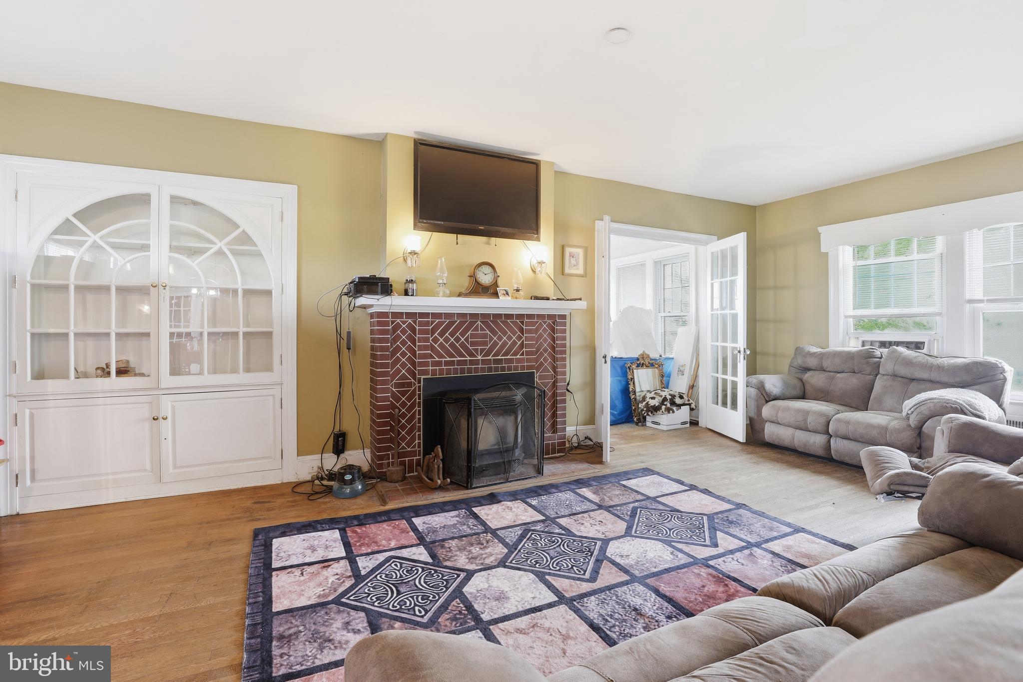 32076 Gordy Road Laurel, DE 19956 - Photo 18 of 52 a living room with furniture a flat screen tv and a fireplace