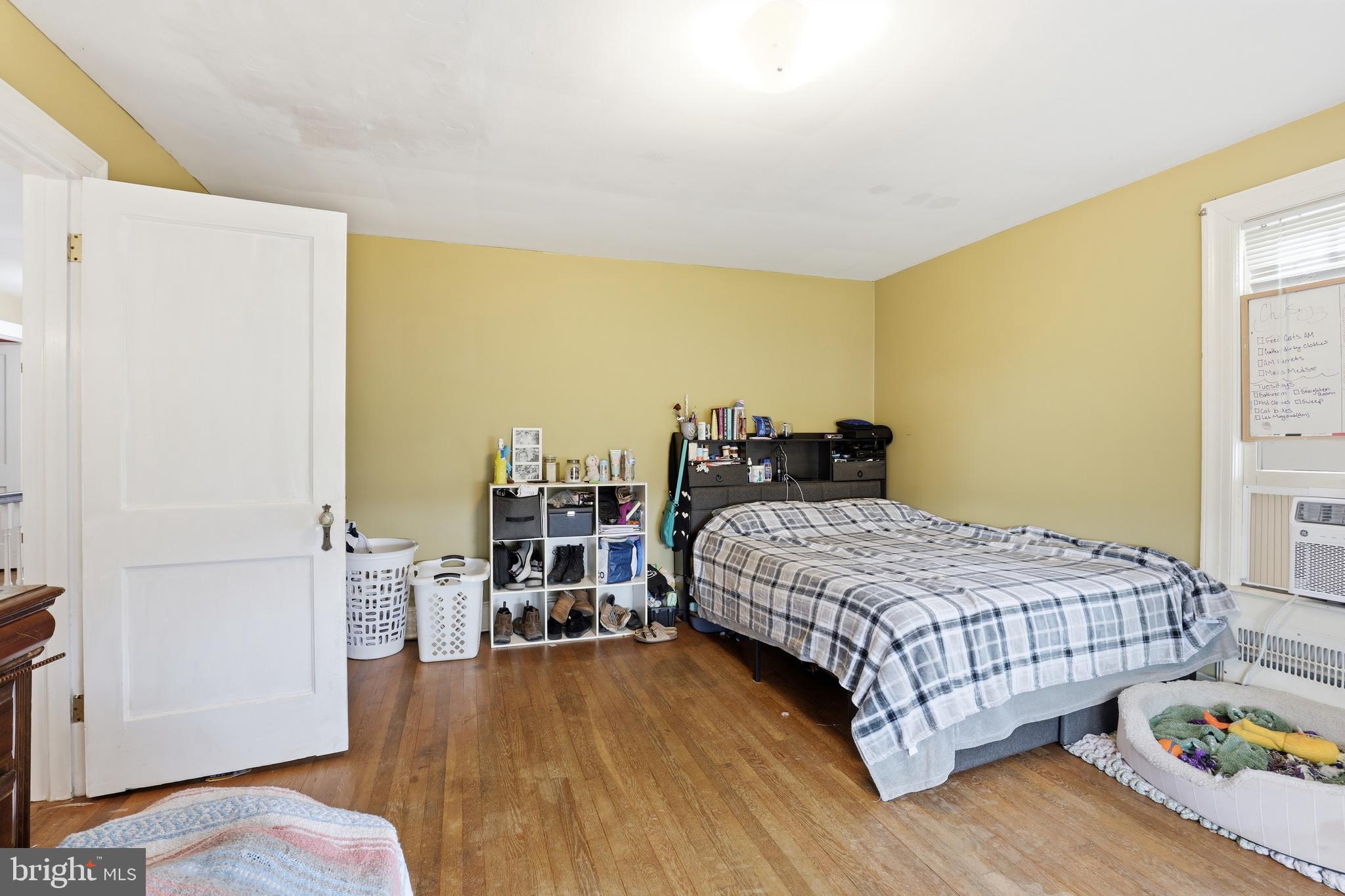 32076 Gordy Road Laurel, DE 19956 - Photo 30 of 52 a bedroom with a bed and wooden floor