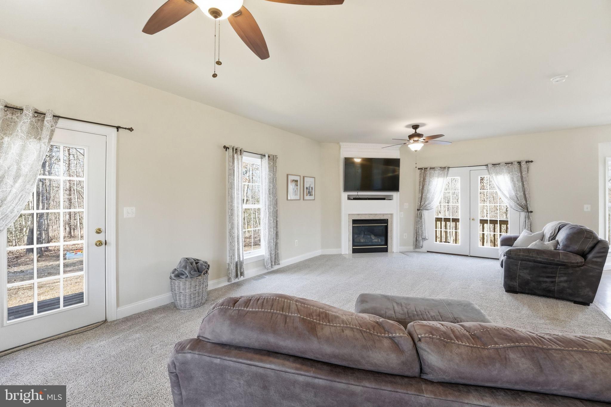 2171 Towles Road Midland, VA 22728 - Photo 15 of 58 a living room with furniture window and fireplace