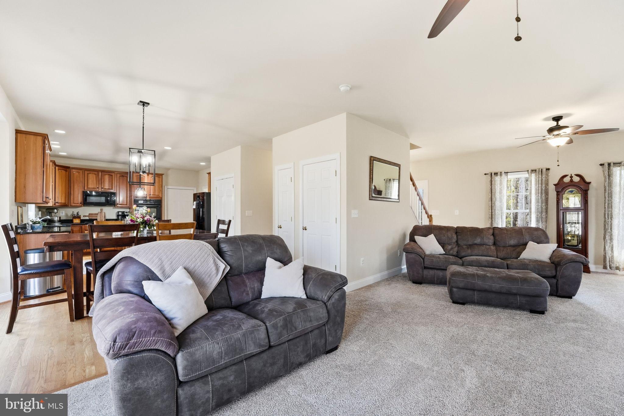 2171 Towles Road Midland, VA 22728 - Photo 18 of 58 a living room with furniture and a chandelier