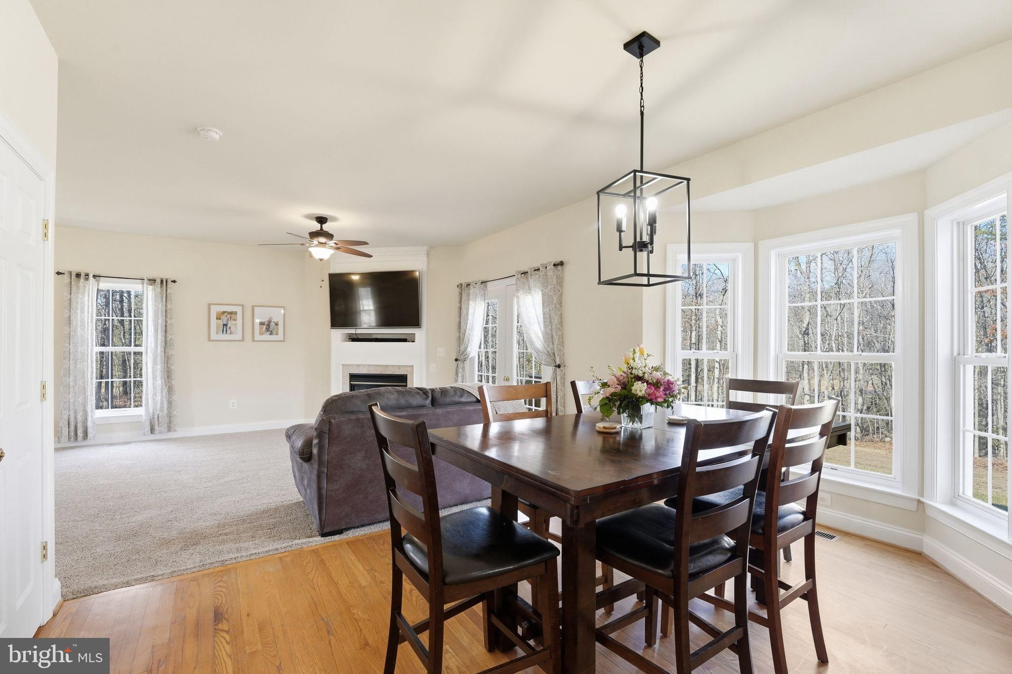 2171 Towles Road Midland, VA 22728 - Photo 19 of 58 a dining room with furniture window and wooden floor