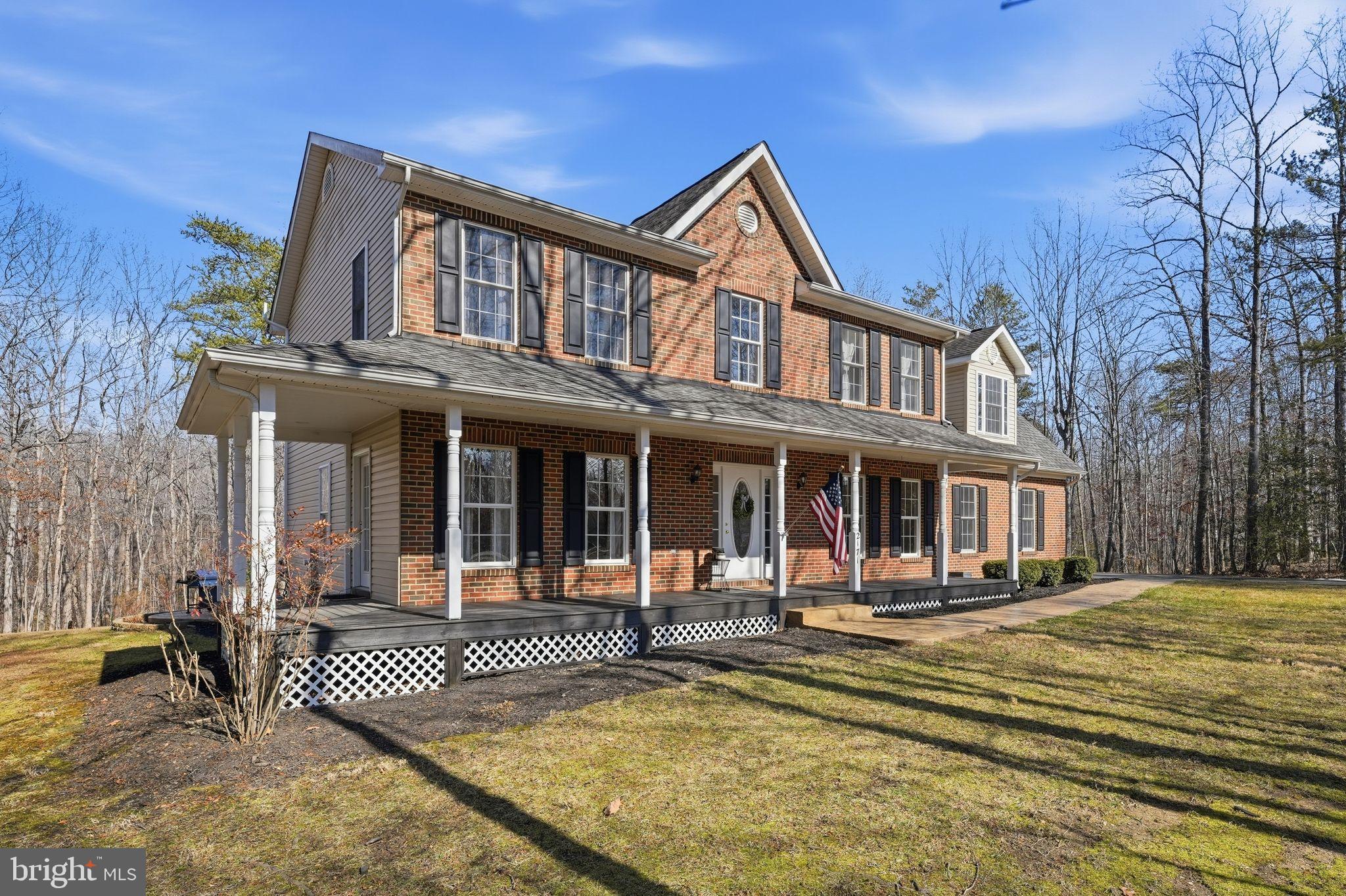 2171 Towles Road Midland, VA 22728 - Photo 3 of 58 a front view of a house with swimming pool and chairs