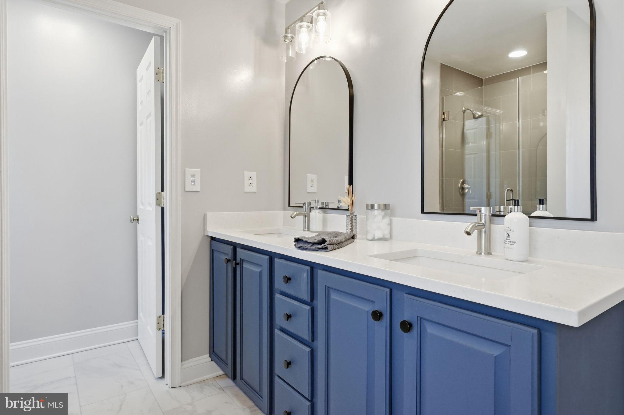 2171 Towles Road Midland, VA 22728 - Photo 32 of 58 a bathroom with a double vanity sink and a mirror