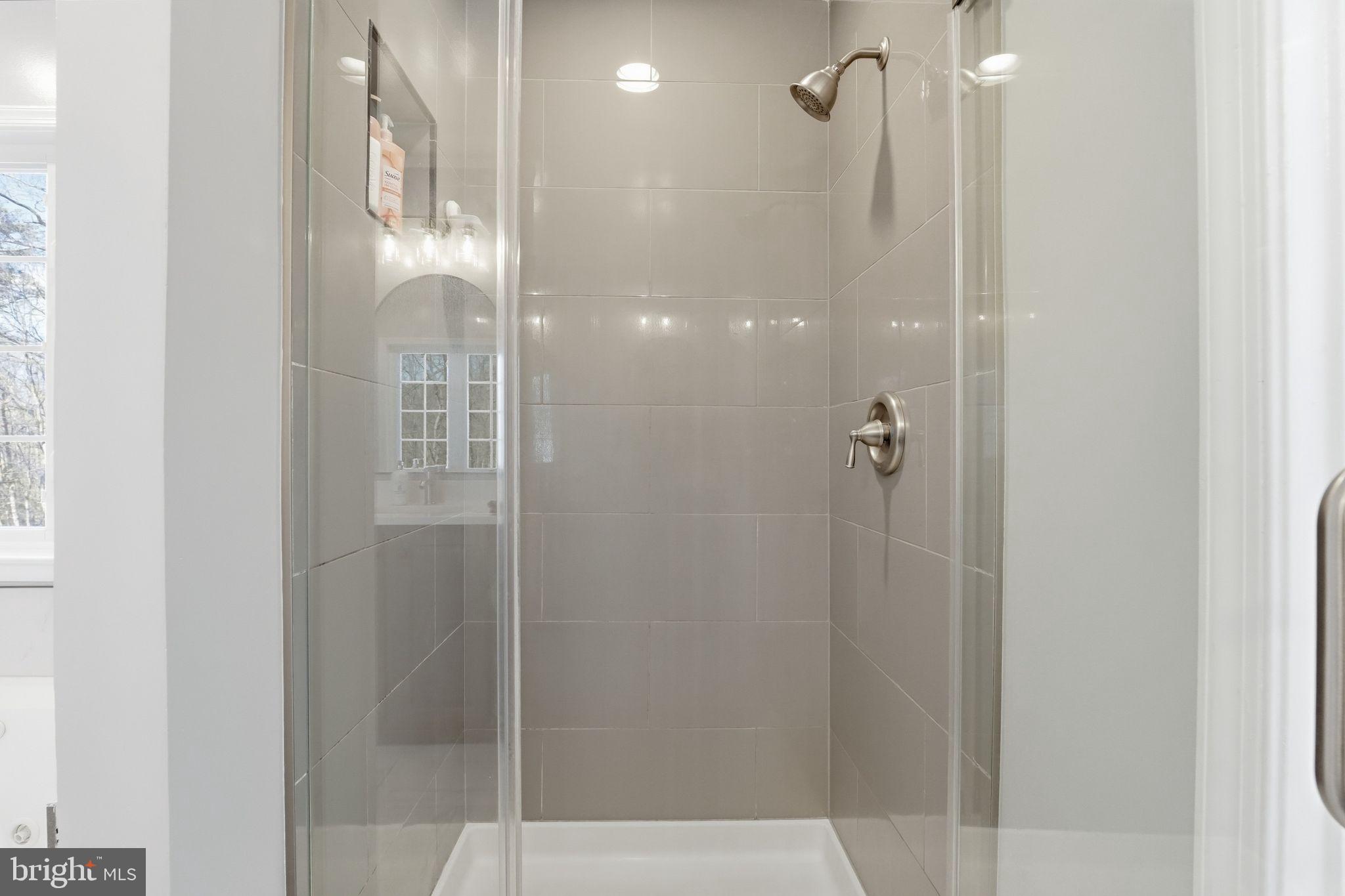 2171 Towles Road Midland, VA 22728 - Photo 33 of 58 a bathroom with a glass shower door
