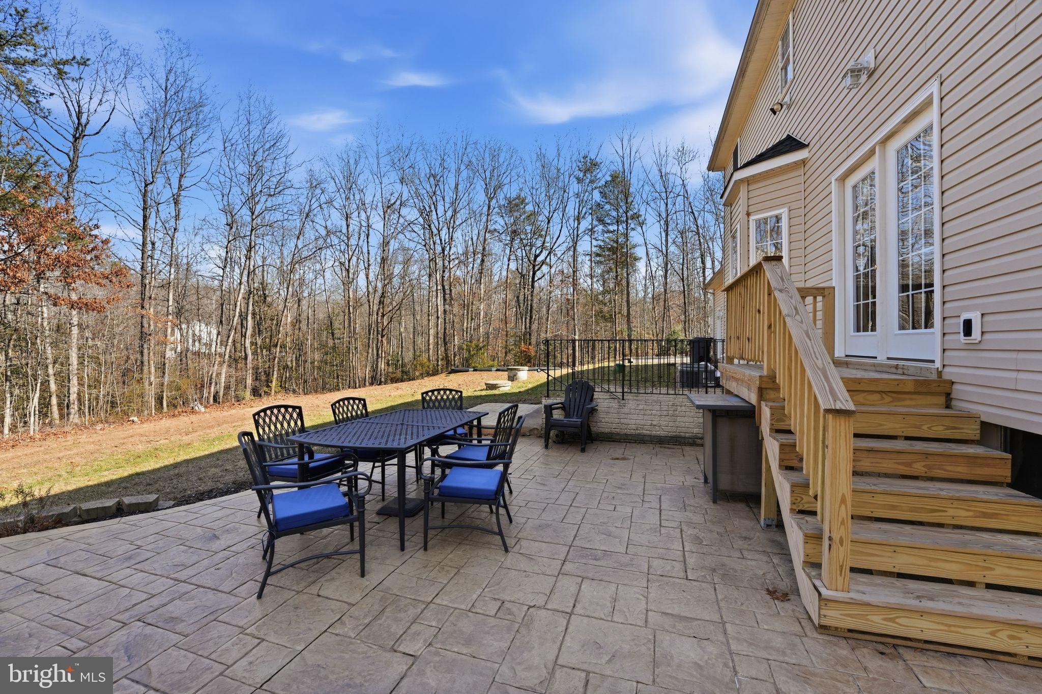 2171 Towles Road Midland, VA 22728 - Photo 47 of 58 a backyard of a house with table and chairs