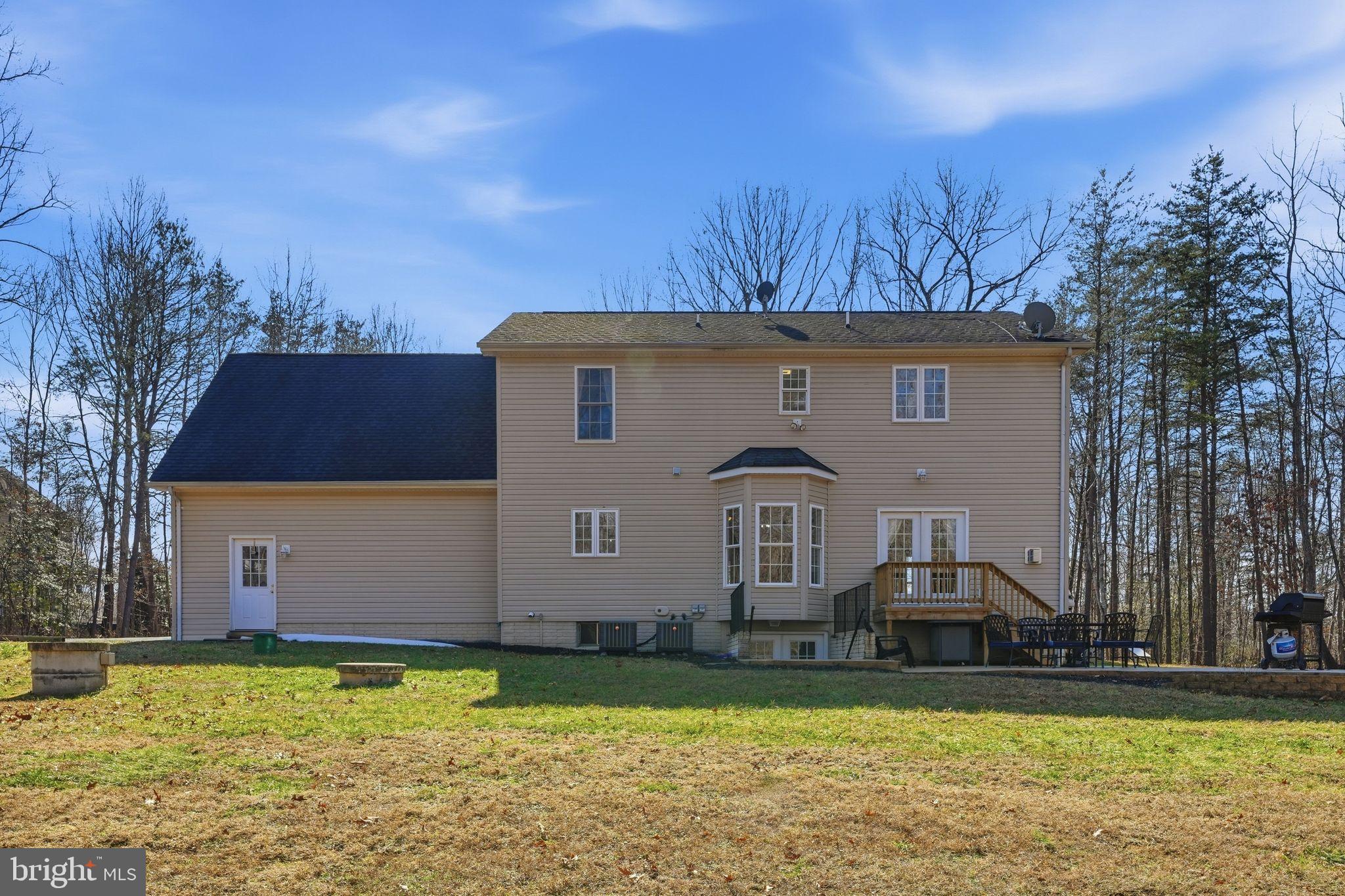 2171 Towles Road Midland, VA 22728 - Photo 49 of 58 a front view of house with yard and trees in the background