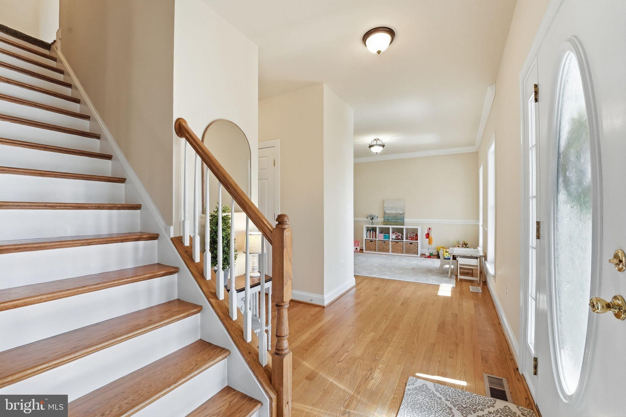 2171 Towles Road Midland, VA 22728 - Photo 10 of 58 a view of a hallway with wooden floor and staircase