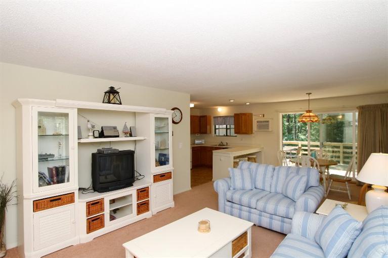 54 Round House Road, Unit 54 Bourne, MA 02532 - Photo 7 of 25 a living room with furniture and a flat screen tv
