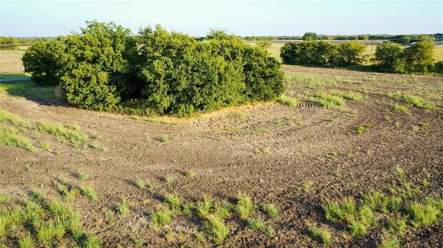 a view of a lake with a yard