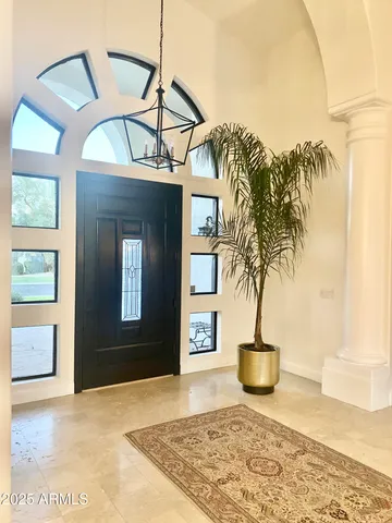 a view of a livingroom with furniture and front door