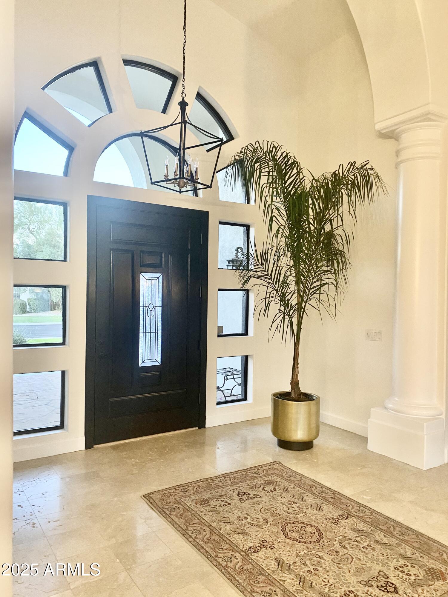 a view of a livingroom with furniture and front door