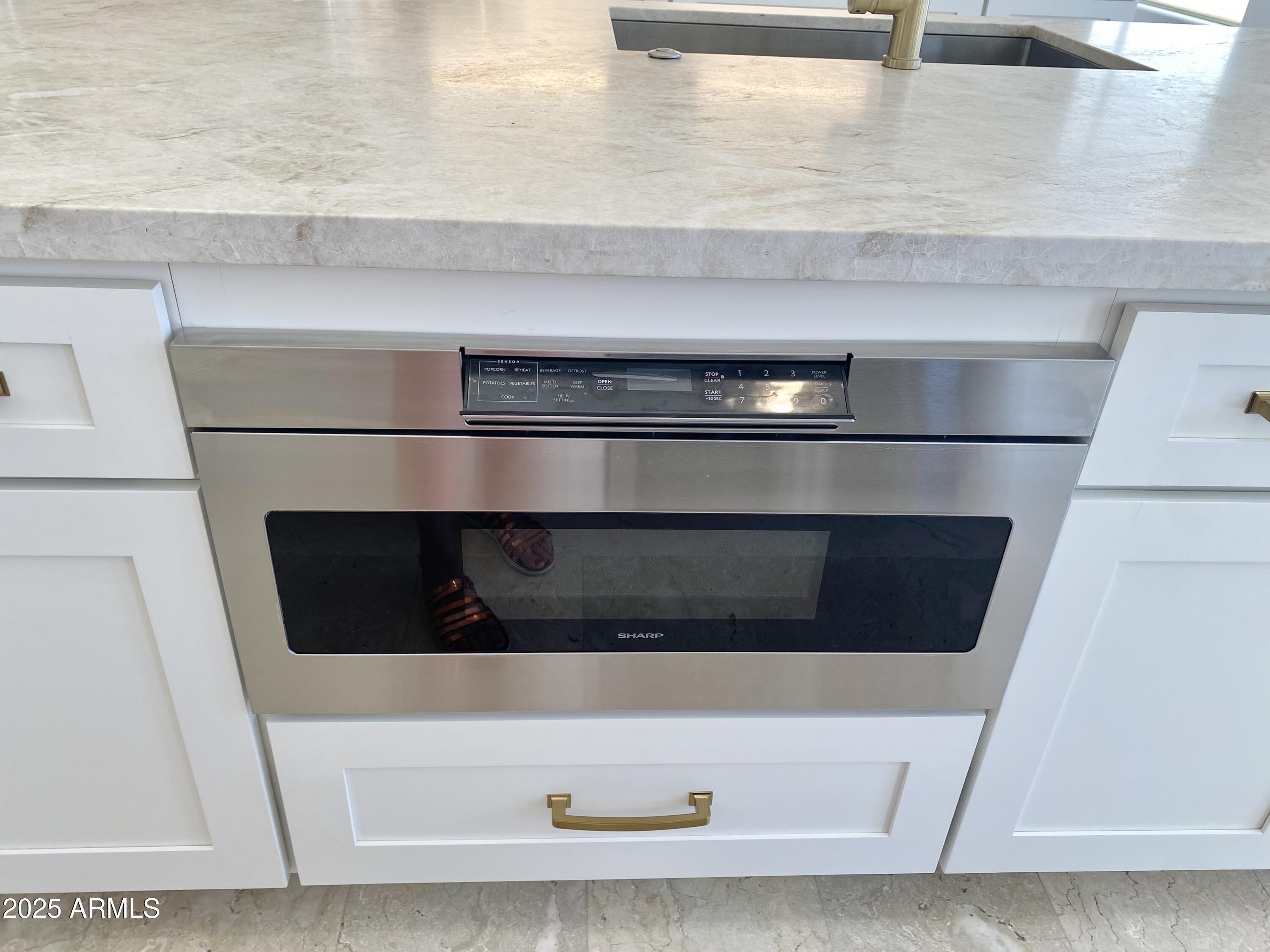 4551 East Cochise Road Phoenix, AZ 85028 - Photo 12 of 43 a stove top oven sitting inside of a kitchen