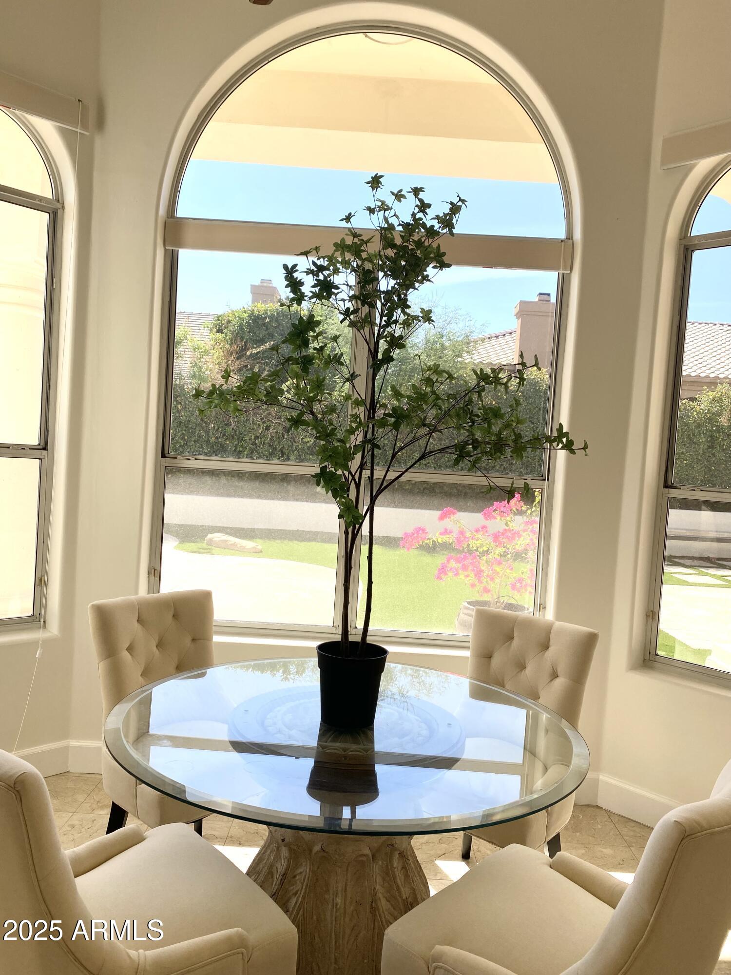 4551 East Cochise Road Phoenix, AZ 85028 - Photo 15 of 43 a view of a dining room with furniture window and outside view
