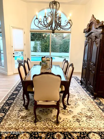 a view of a very nice looking dining room with furniture window and outside view