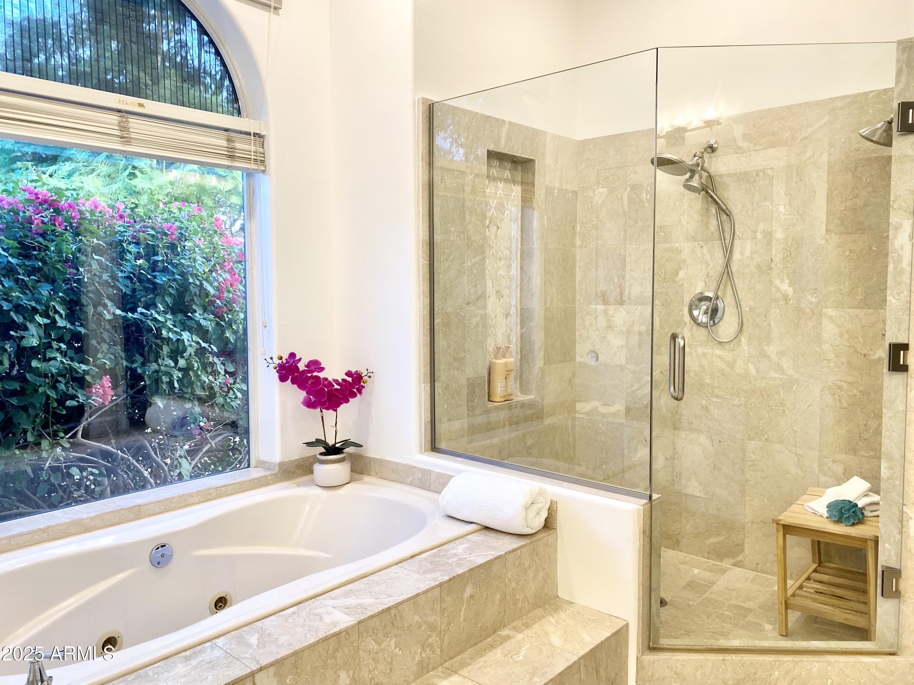 4551 East Cochise Road Phoenix, AZ 85028 - Photo 21 of 43 a bathroom with a tub shower and window