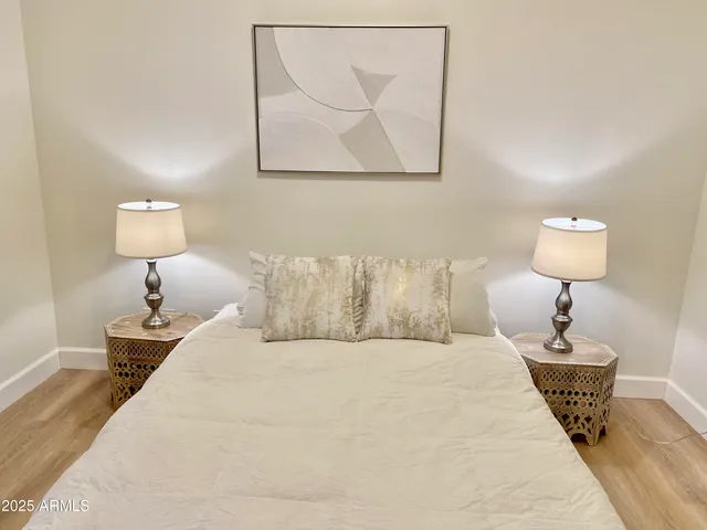 a bed room with a bed and a lamp