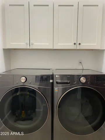 a utility room with washing machine
