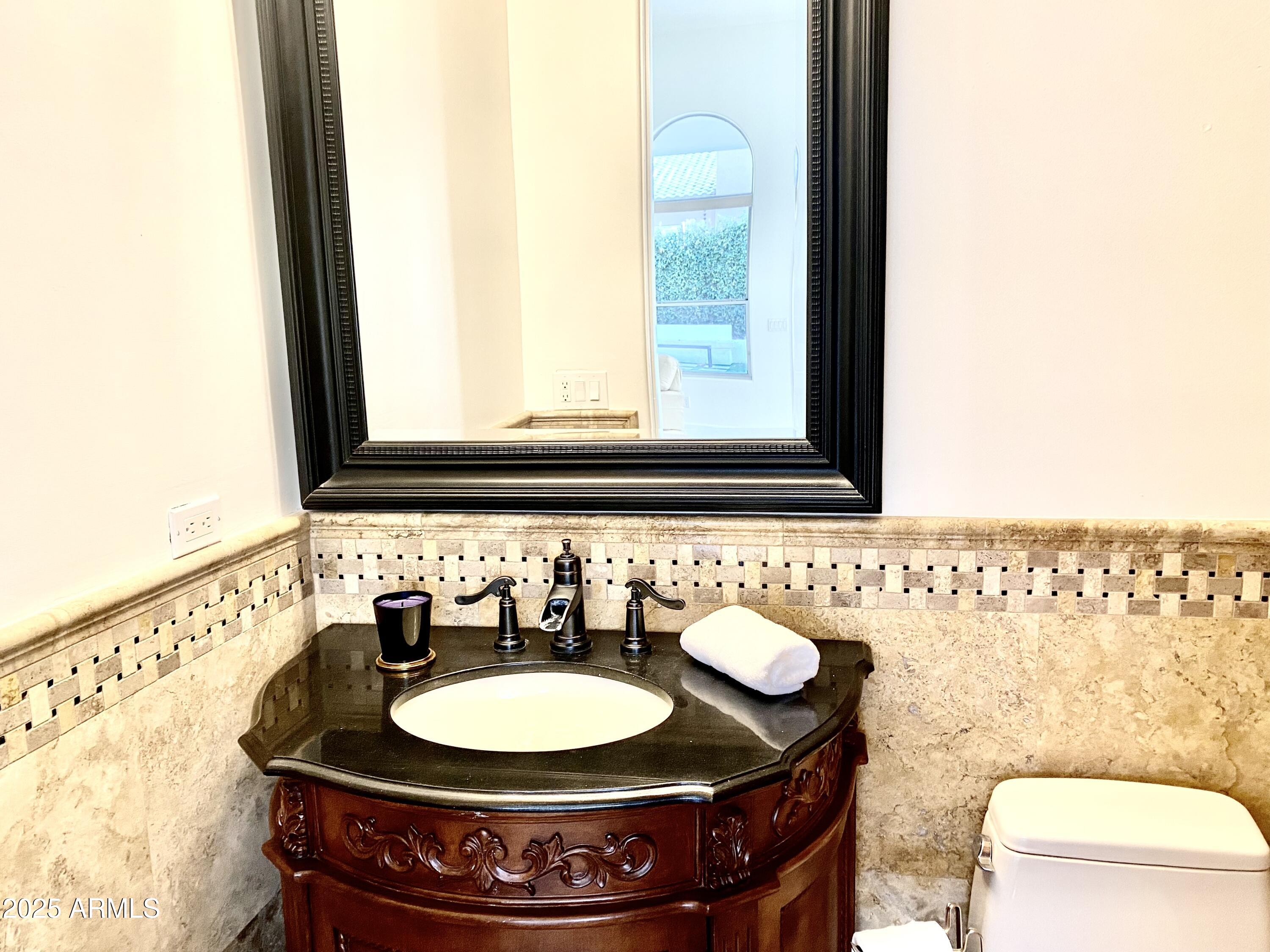 4551 East Cochise Road Phoenix, AZ 85028 - Photo 34 of 43 a bathroom with a sink and a mirror