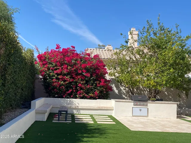 a view of a yard with an outdoor seating