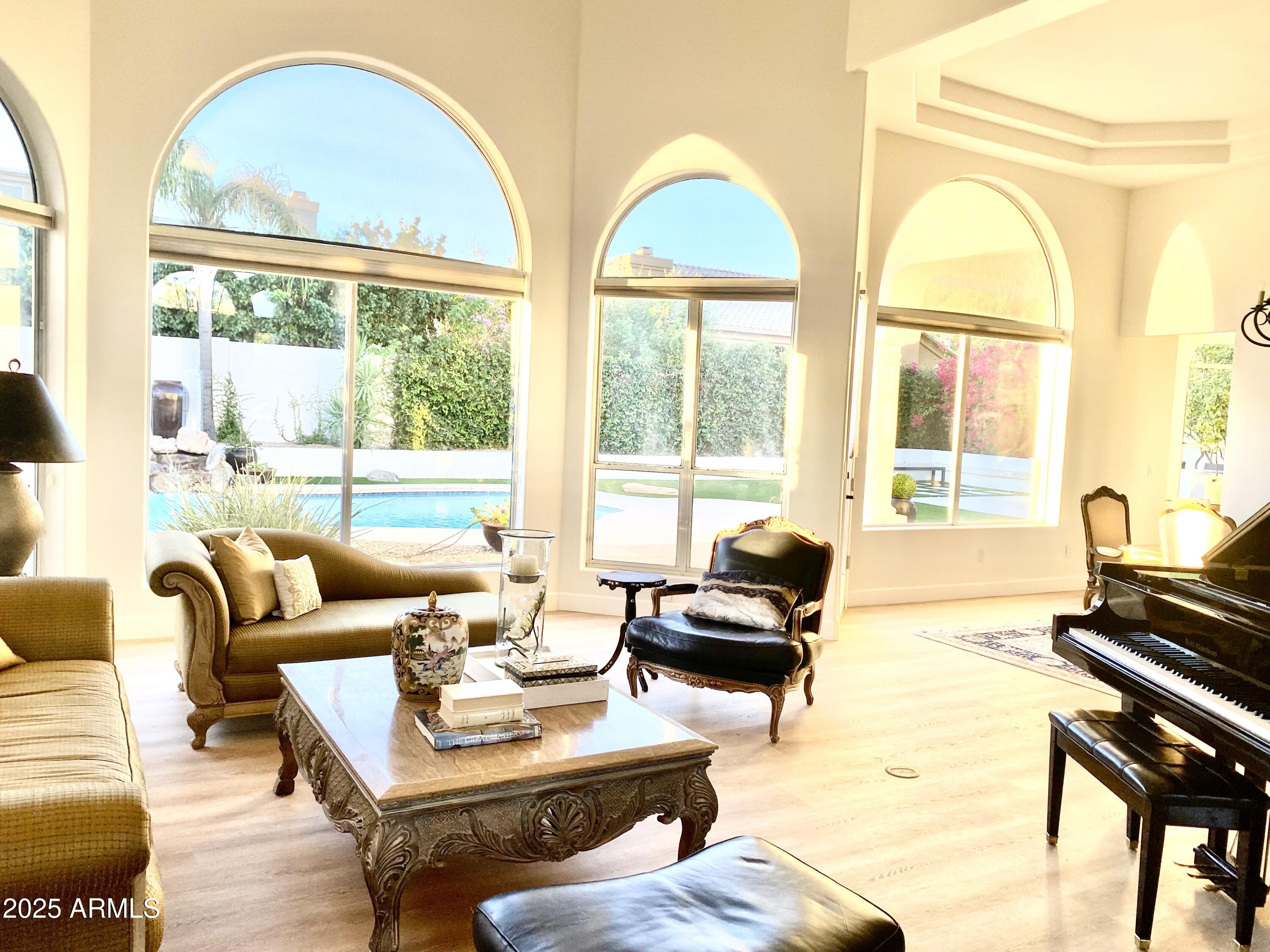 4551 East Cochise Road Phoenix, AZ 85028 - Photo 4 of 43 a living room with furniture and a large window