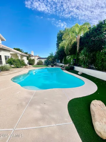 a view of outdoor space with swimming pool