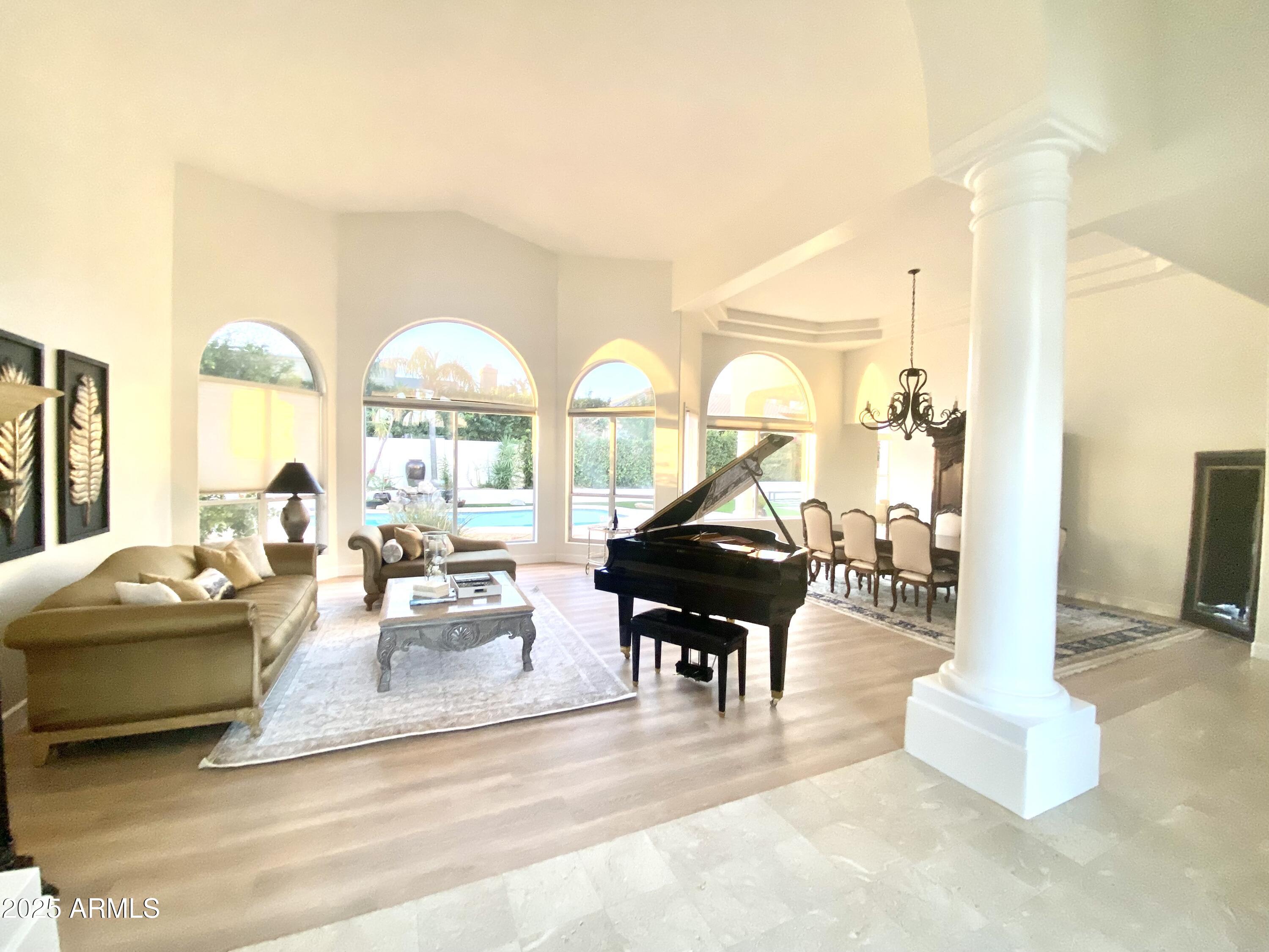 4551 East Cochise Road Phoenix, AZ 85028 - Photo 5 of 43 a living room with fireplace furniture and a large window