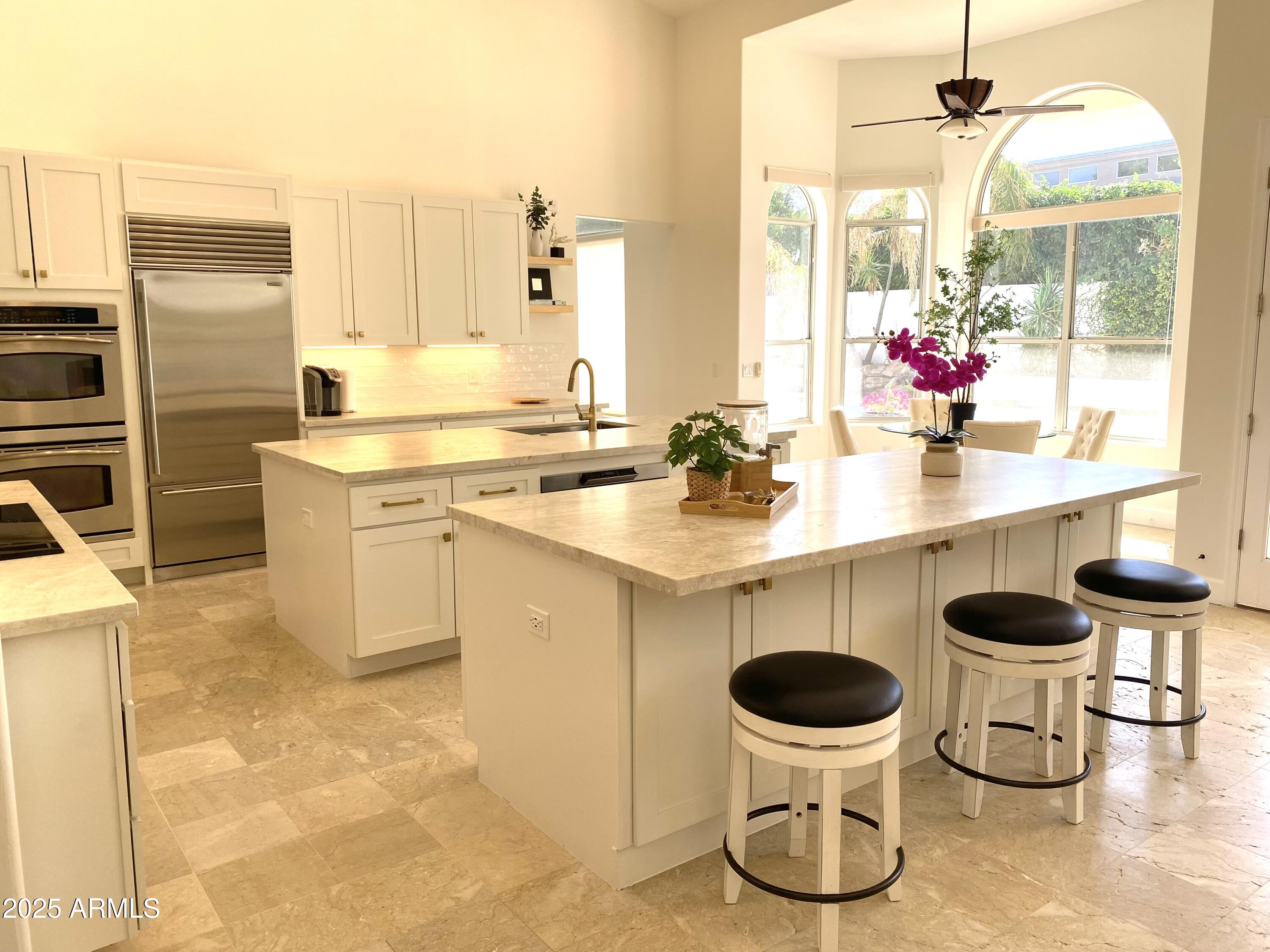 4551 East Cochise Road Phoenix, AZ 85028 - Photo 10 of 43 a kitchen with a sink and a stove