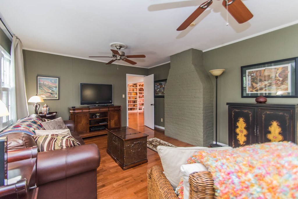 652 Bass Road Macon, GA 31210 - Photo 3 of 25 a bedroom with furniture and a flat screen tv