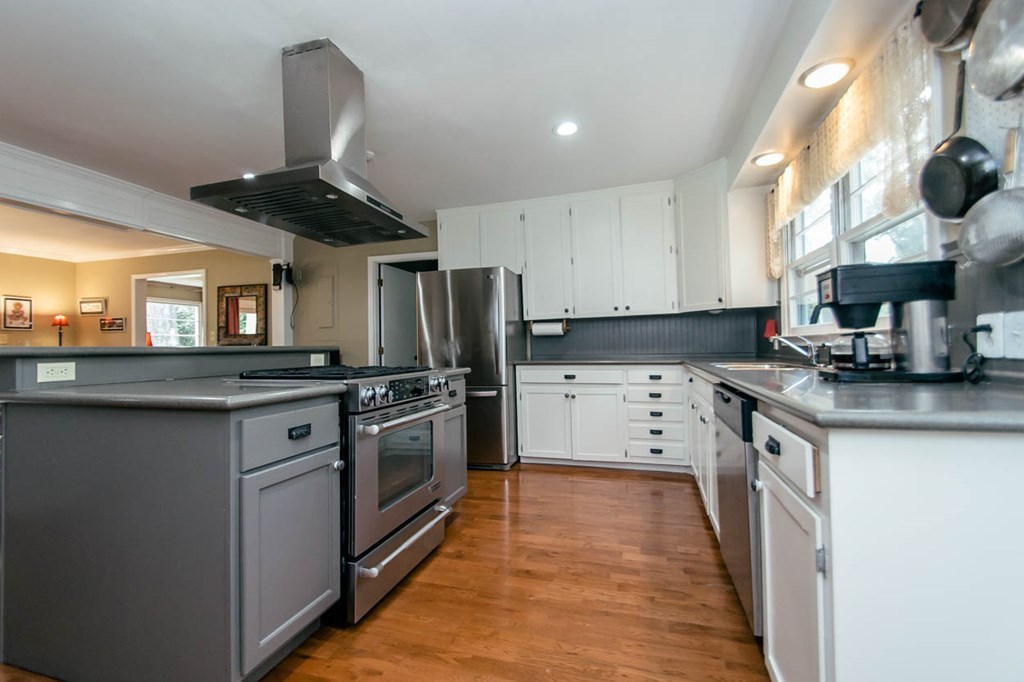 652 Bass Road Macon, GA 31210 - Photo 8 of 25 a kitchen with stainless steel appliances granite countertop a stove a sink and a refrigerator