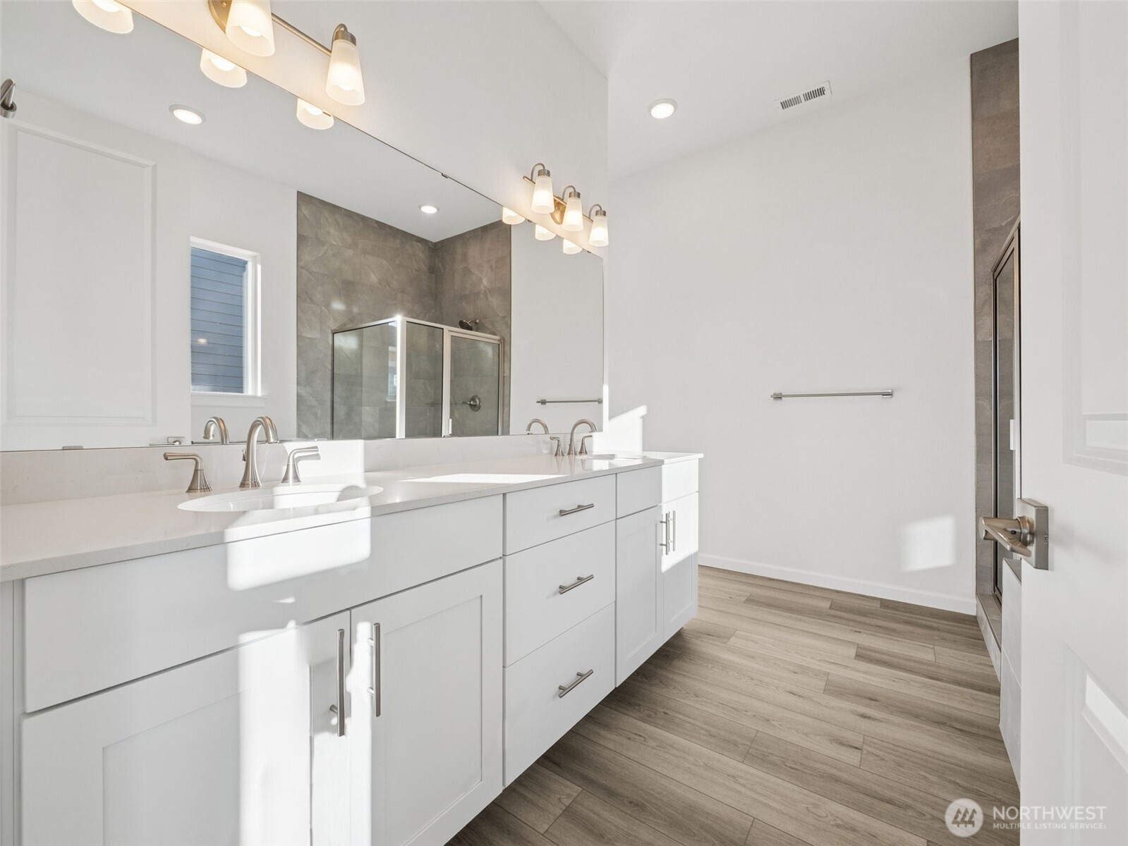 749 South Davis Street, Unit 104 Buckley, WA 98321 - Photo 7 of 11 a bathroom with a double vanity sink and a mirror