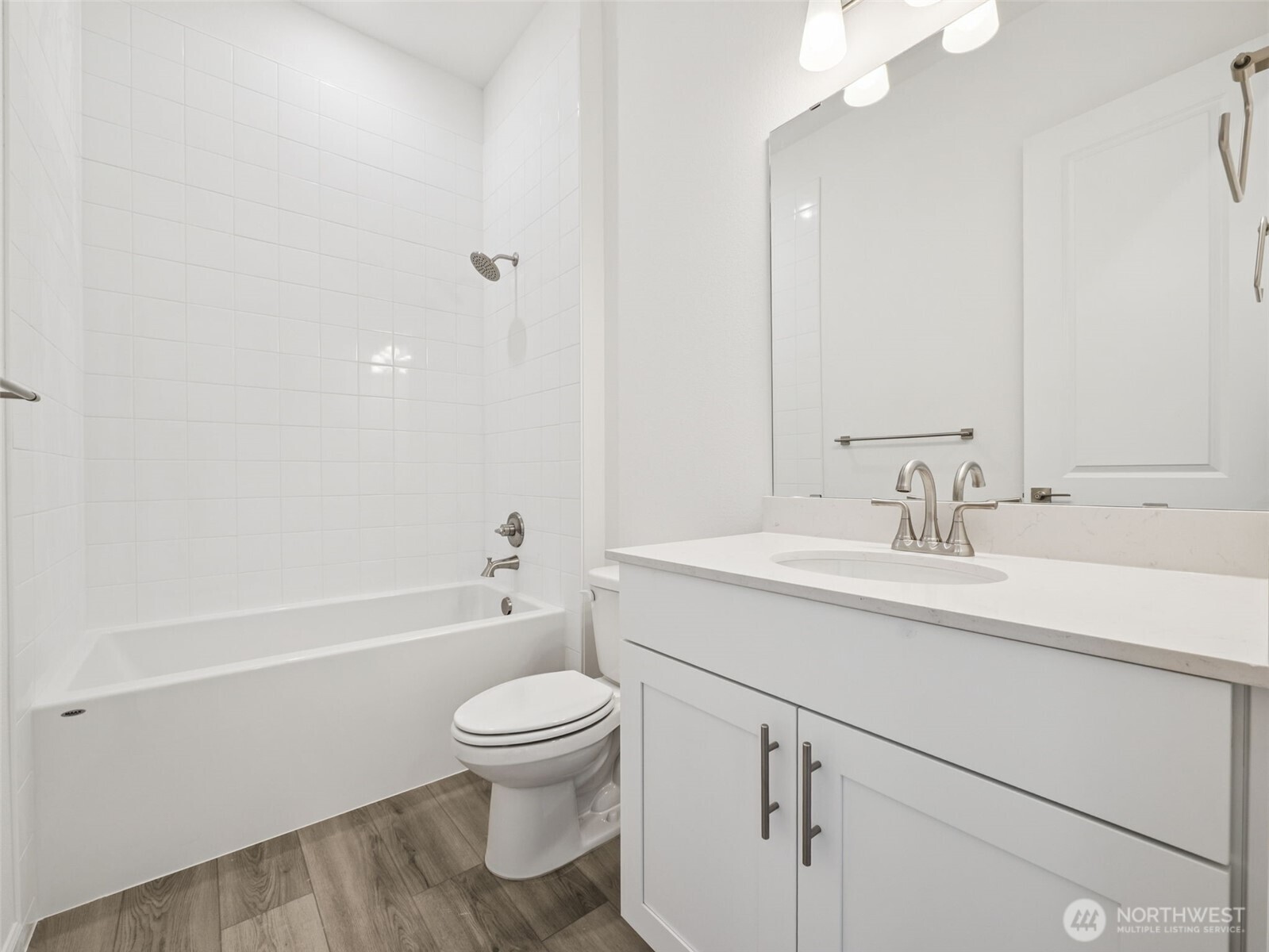 749 South Davis Street, Unit 104 Buckley, WA 98321 - Photo 10 of 11 a bathroom with a sink toilet vanity and shower