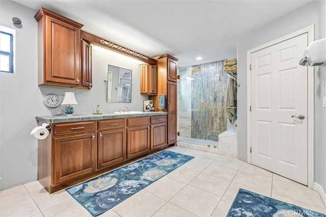 a view of a bedroom with furniture and window