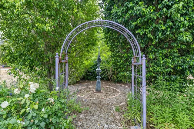 a view of a house with a tree
