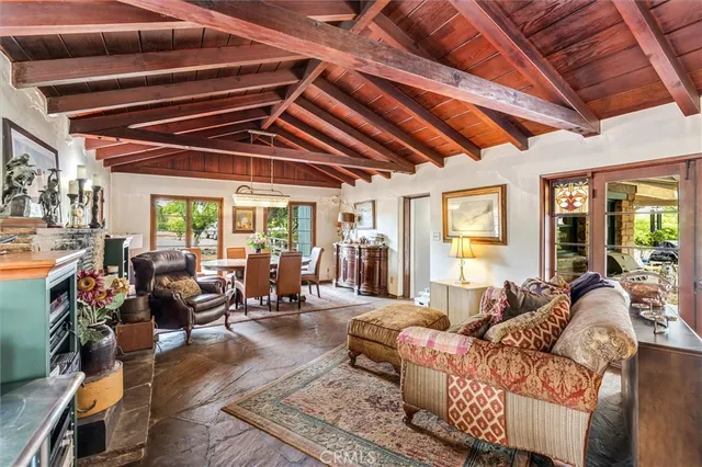 a living room with furniture lots of tables and chairs