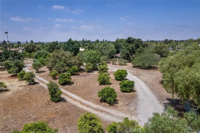 an aerial view of house with yard swimming pool and outdoor seating