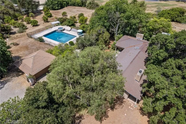 a backyard of a house with a yard and outdoor seating