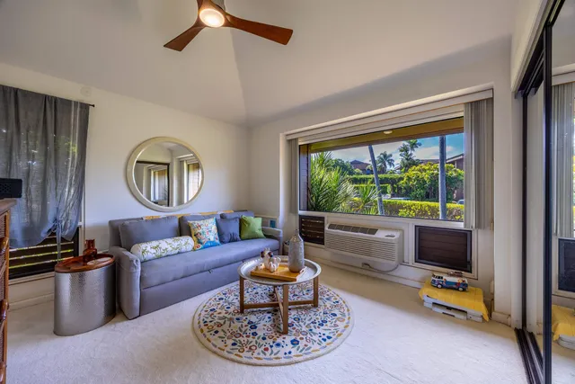 a view of a patio with table and chairs potted plants