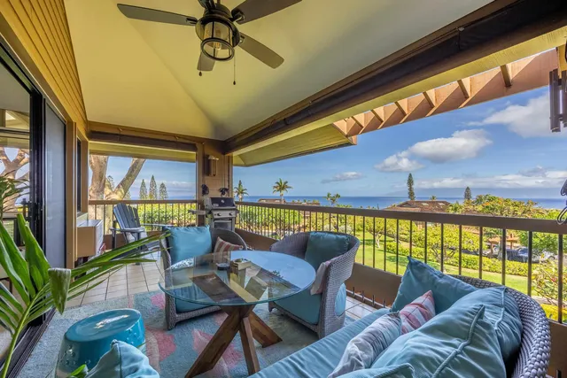 a living room with lots of furniture and kitchen view