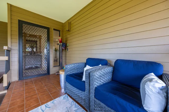 a bathroom with a toilet and shower