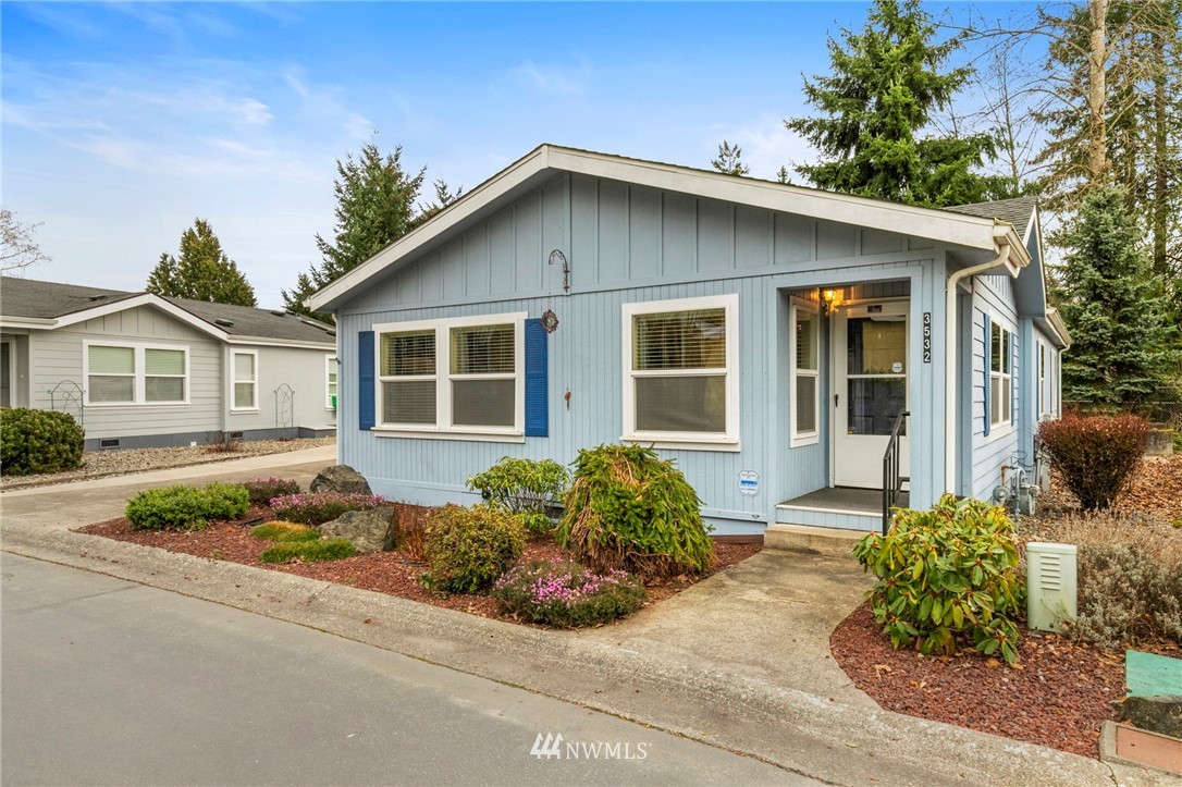front view of a house with potted plants