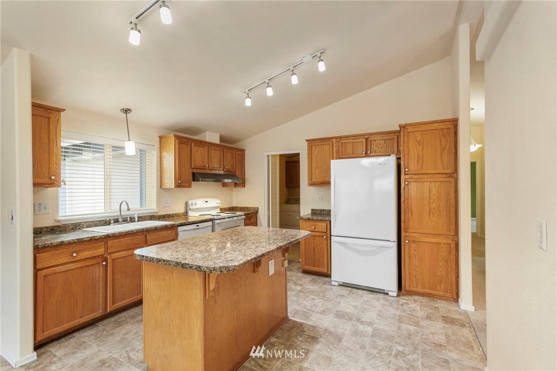 3532 Sylvan Pines Circle Bremerton, WA 98310 - Photo 11 of 22 a kitchen with refrigerator cabinets and furniture