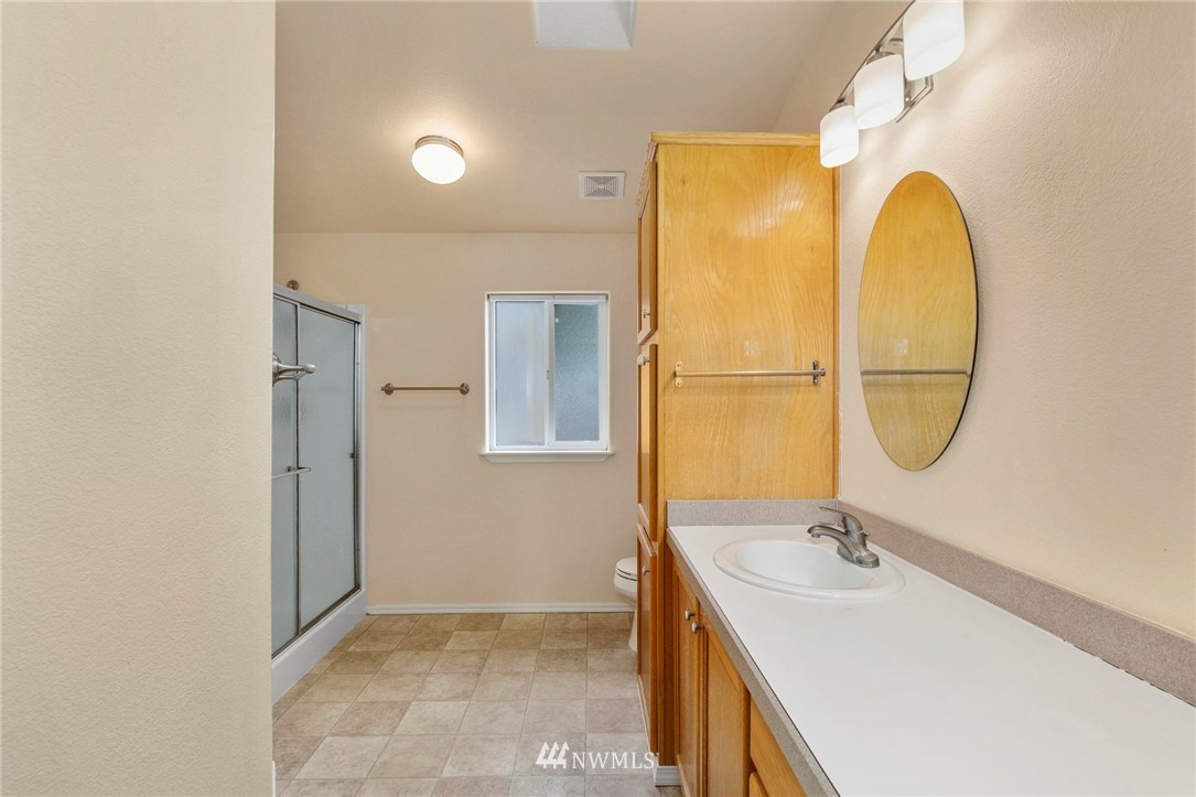 3532 Sylvan Pines Circle Bremerton, WA 98310 - Photo 18 of 22 a bathroom with a sink and a mirror