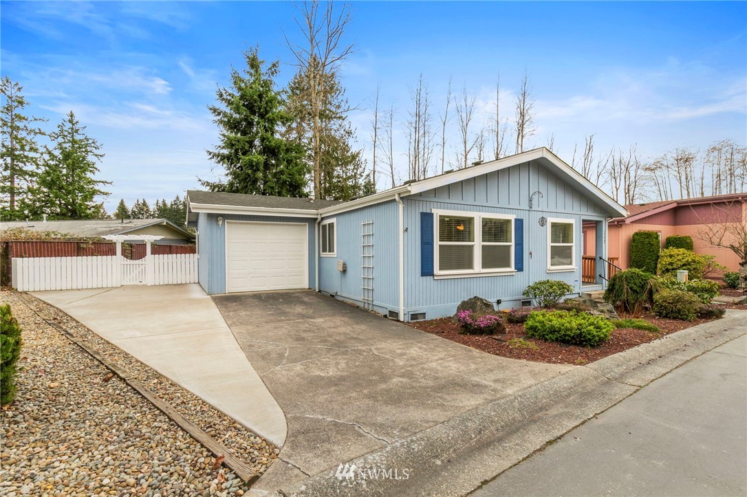 3532 Sylvan Pines Circle Bremerton, WA 98310 - Photo 2 of 22 a front view of a house with garden