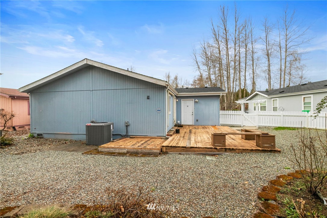 3532 Sylvan Pines Circle Bremerton, WA 98310 - Photo 22 of 22 a backyard of a house with table and chairs