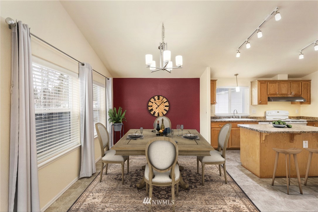 3532 Sylvan Pines Circle Bremerton, WA 98310 - Photo 4 of 22 a view of a dining room with furniture window and wooden floor