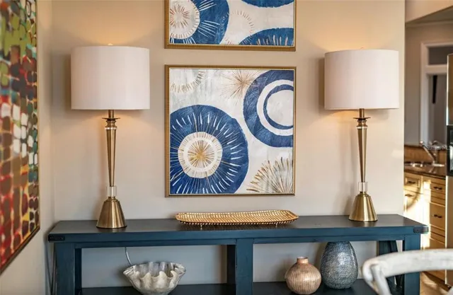 a kitchen with a table chairs stove and cabinets