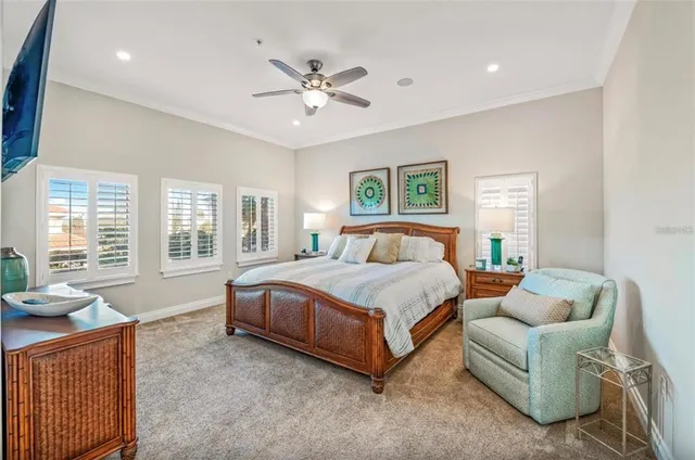 a bedroom with a bed and ceiling fan