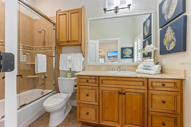 a bathroom with a sink a vanity and a window