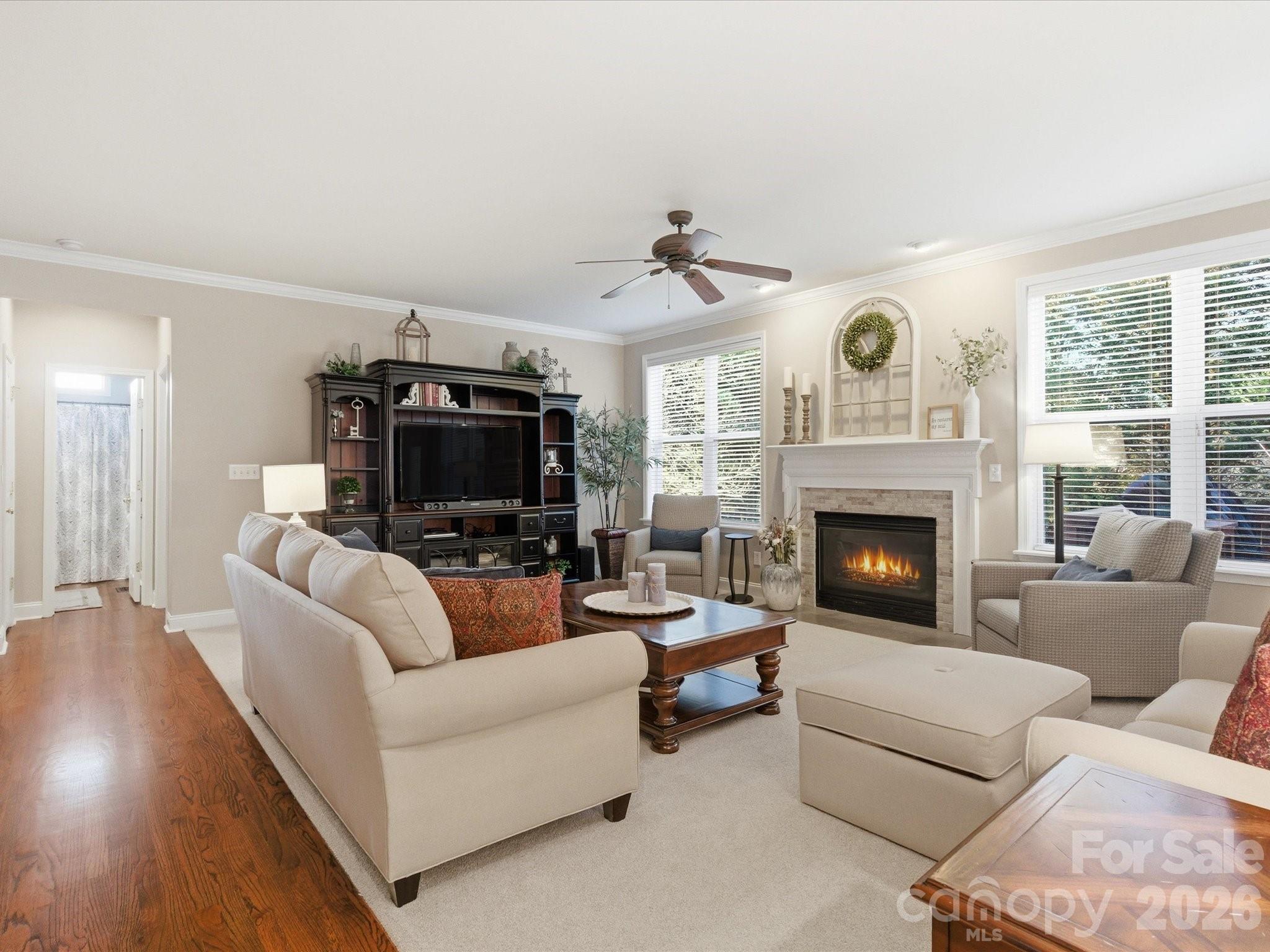 6318 Riverside Oaks Drive Huntersville, NC 28078 - Photo 14 of 48 a living room with furniture and a fireplace
